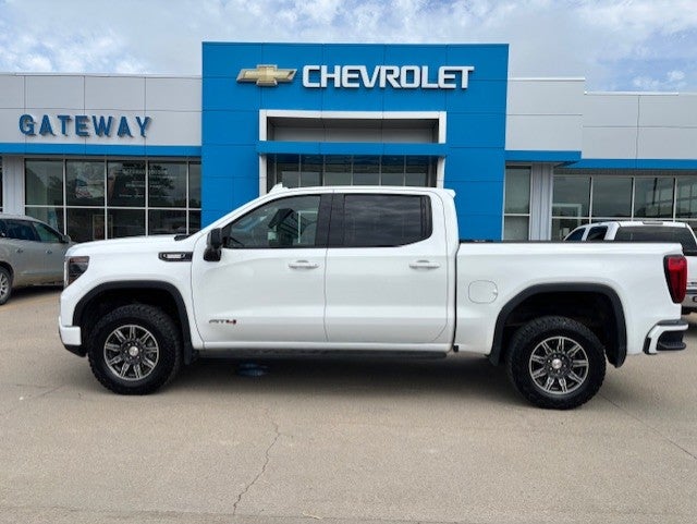 2024 GMC Sierra 1500 AT4 in Summit White — front three-quarter view